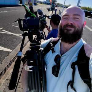 Jamie Somers filming a wedding ceremony with a camera rig